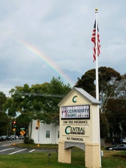 Central One sign with flagpole and rainbow overhead